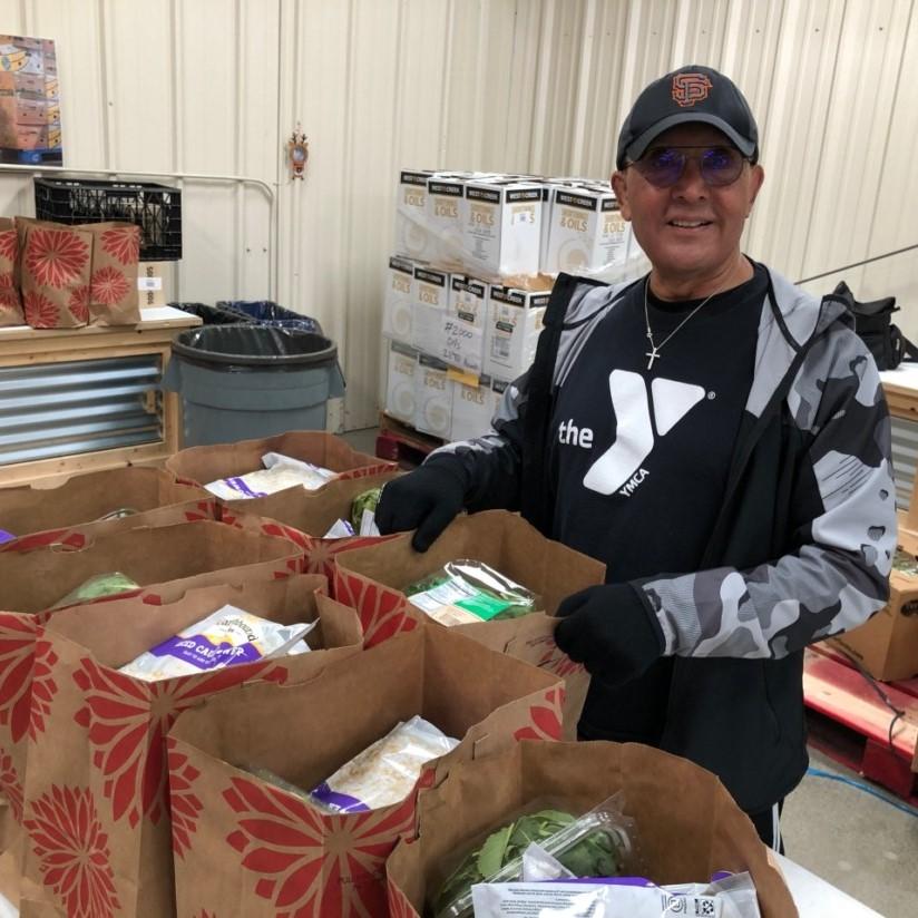 volunteer working at a food drive
